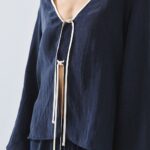 Blouse with trim detailing and tie-up cords