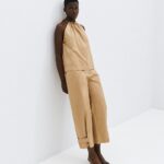 Pants with adjustable buttons at the hem