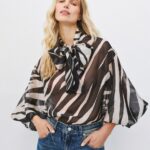 Animal print blouse with a tie