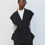 Sleeveless blazer with belt